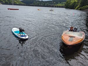 bron on sup with power boat